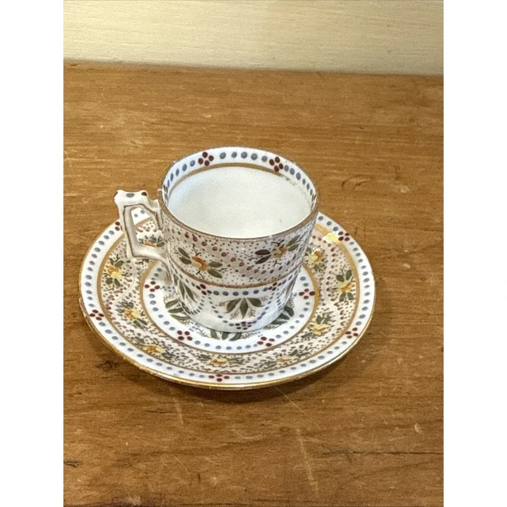 Antique Austrian demitasse cup and saucer hand painted floral gold trim
